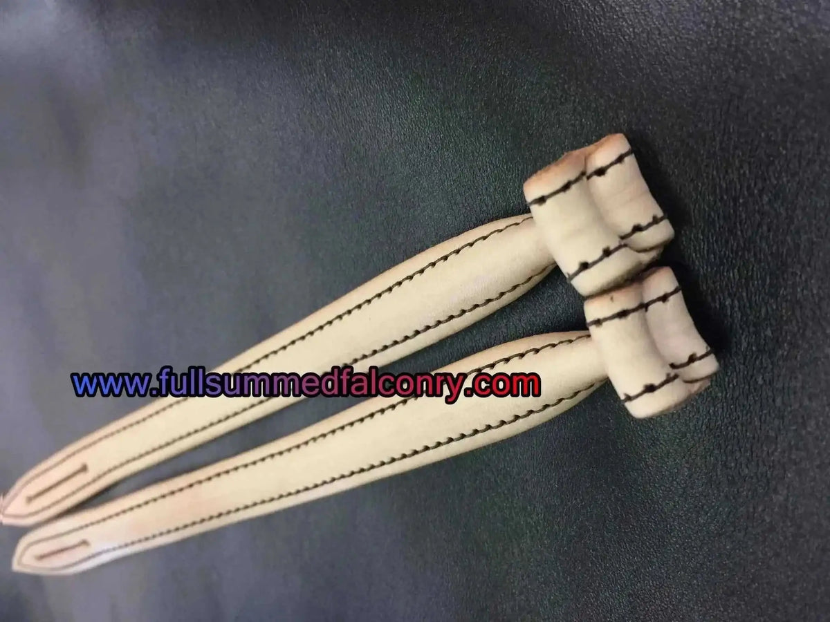 Light tan leather mews jesses with bonded nylon stitching for falconry